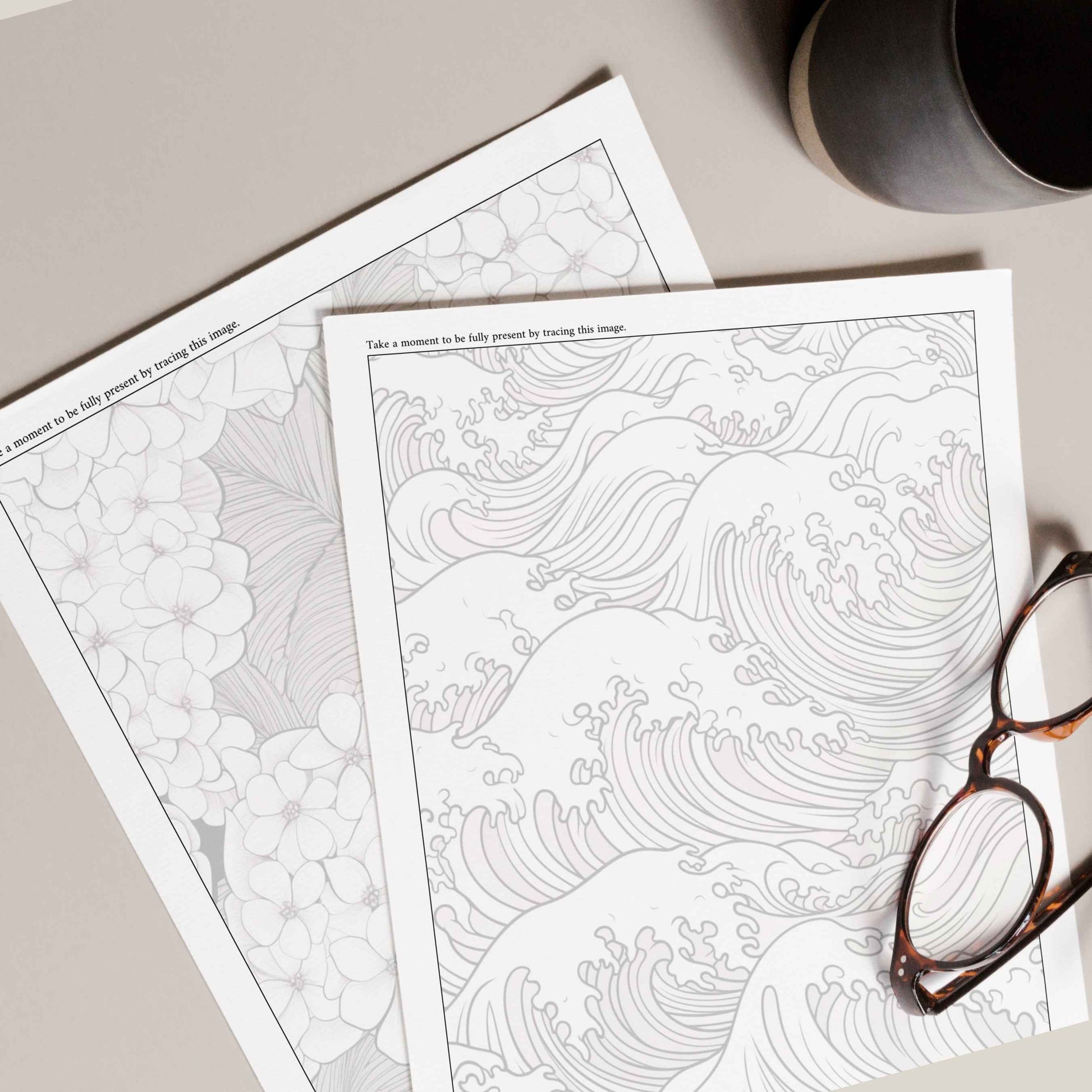 Close-up of two tracing pages from The Calming Colorbook, featuring intricate wave and floral designs for mindfulness and relaxation.