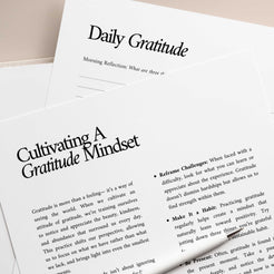 Pages from the Gratitude Journal focusing on cultivating a gratitude mindset, with insights on reframing challenges and practicing daily appreciation.