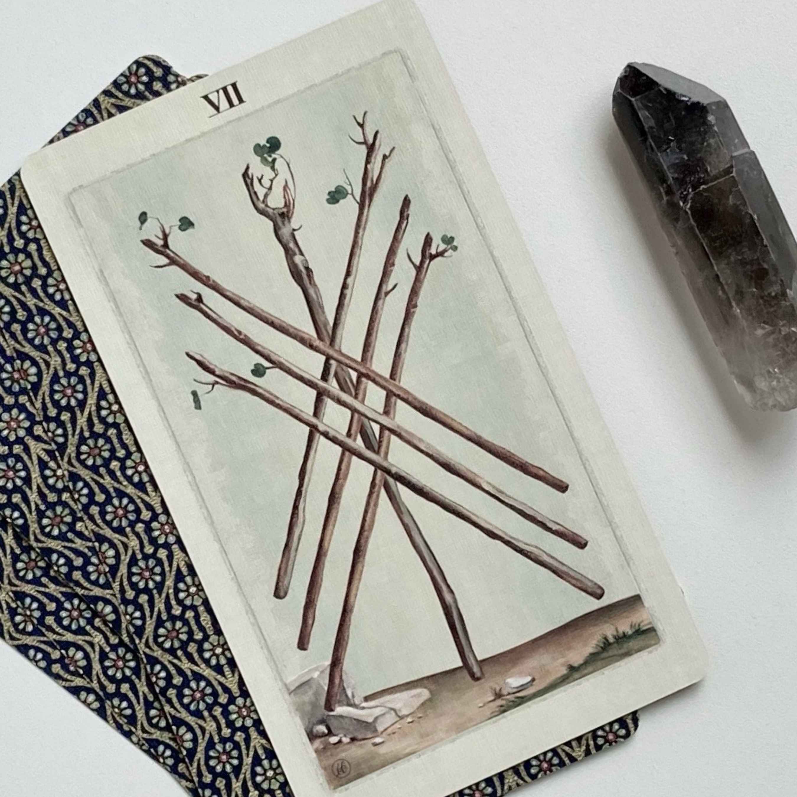 Tarot card from a virtual personal reading featuring the Seven of Wands, symbolizing challenges and perseverance, alongside a crystal for personal reflection.